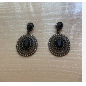 Vintage looking black earrings with light blue/green border